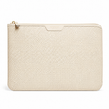 Front view of beige perforated leather laptop sleeve.