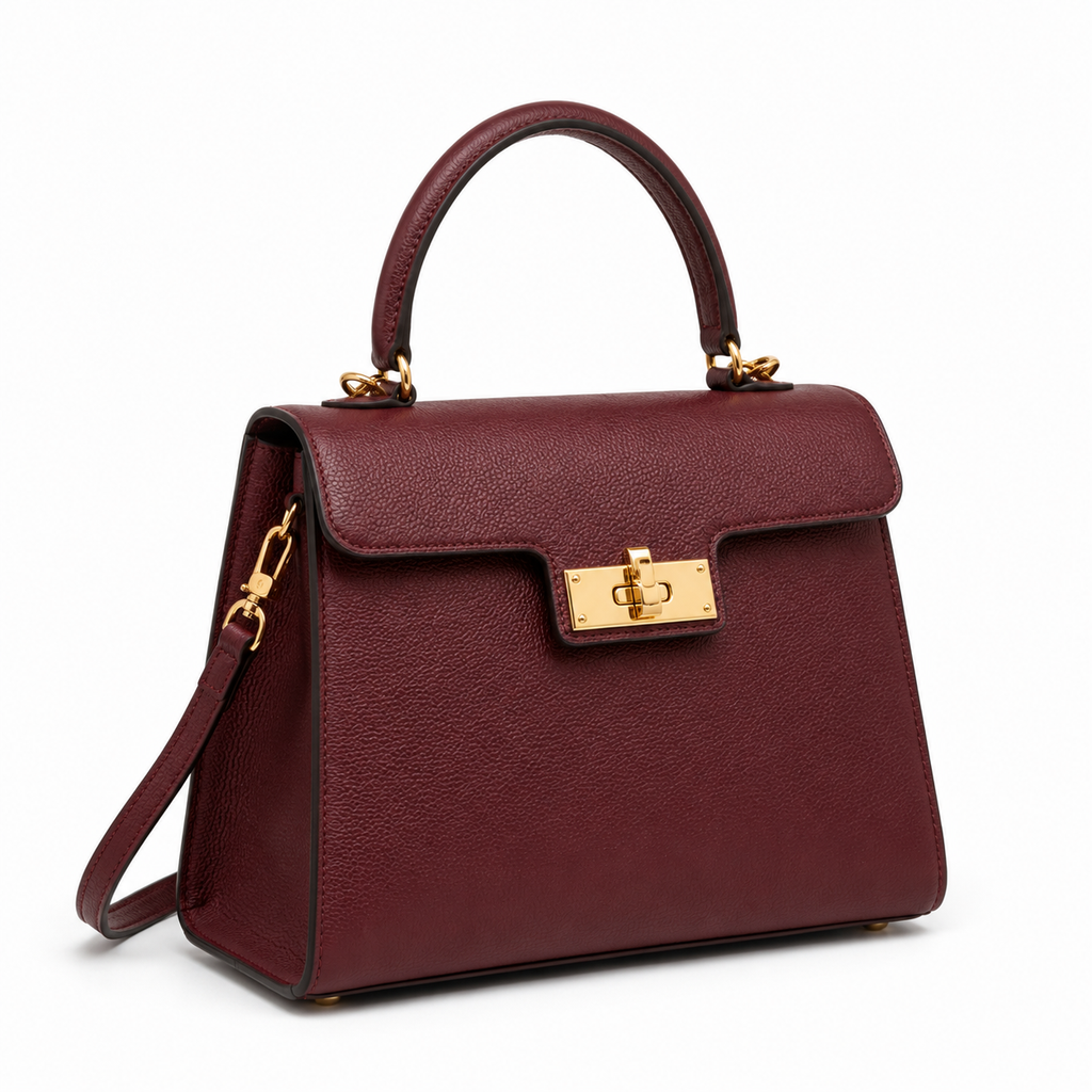 Side view of leather handbag showing detachable strap.