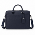 Front view of navy leather briefcase with handles and strap.