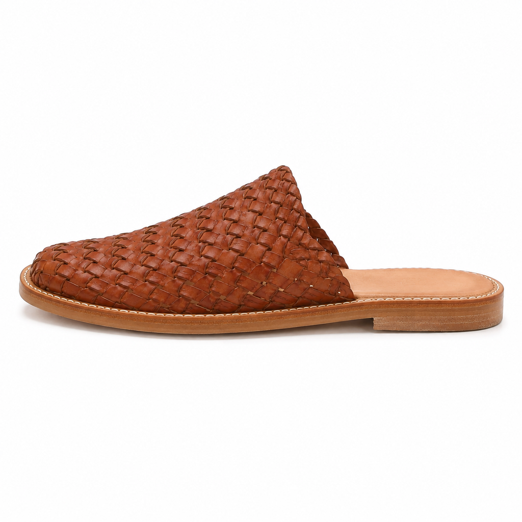 Men's woven vegan leather mule in cognac brown with hand-woven interlocking diamond pattern and natural tan footbed, three-quarter view