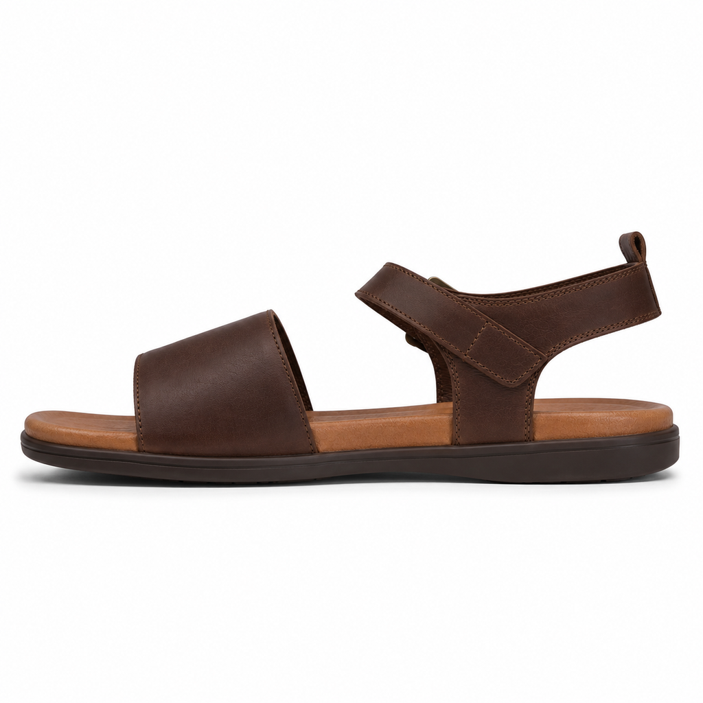Men's classic single-buckle vegan leather sandal in chestnut brown with antique brass ankle buckle and cushioned tan footbed, three-quarter view
