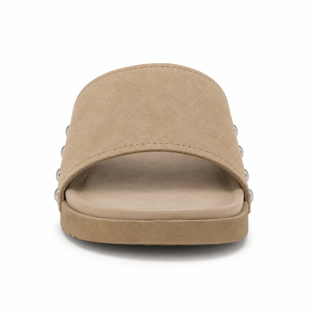 Inner side view of men's sand-beige vegan suede slide sandal showing four brushed silver rivets along the strap edge