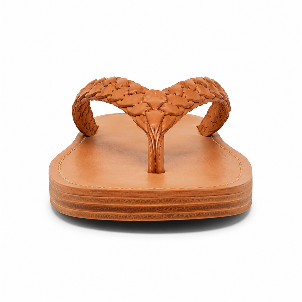 Side profile of men's tan braided vegan leather thong sandal showing braided Y-strap and slim refined leather sole