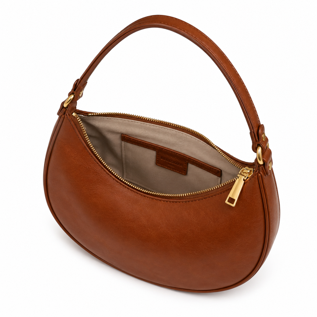 Detail of the shoulder strap and gold hardware.