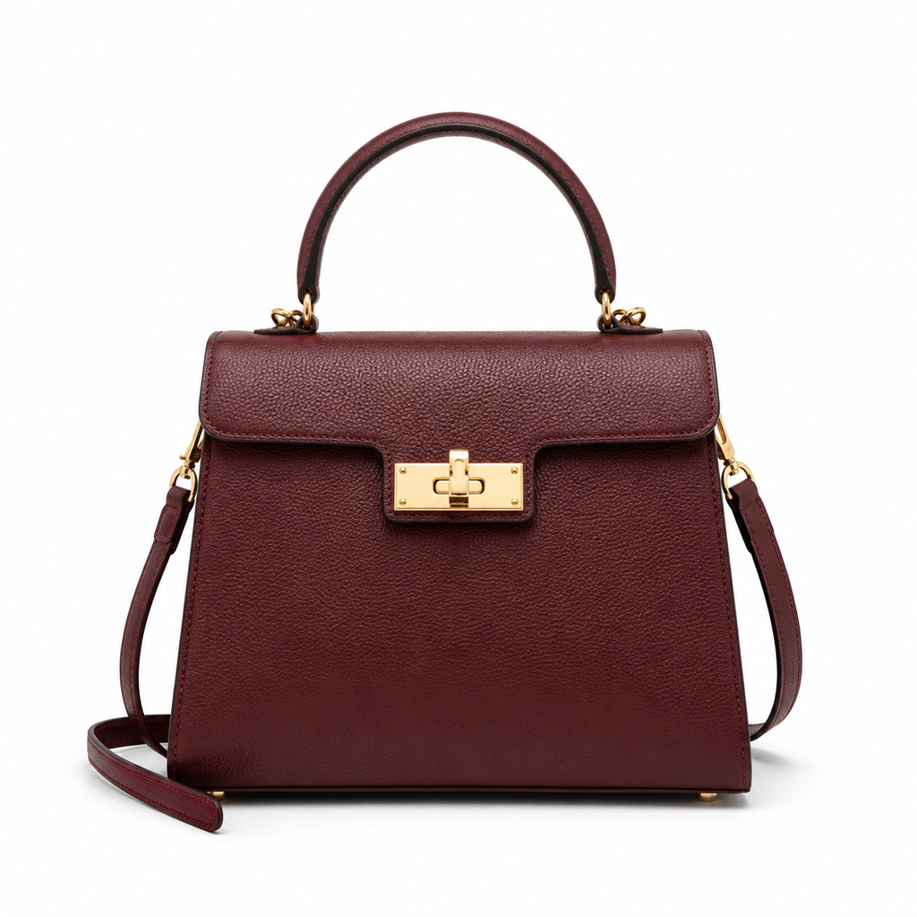 Front view of burgundy leather handbag with gold hardware.