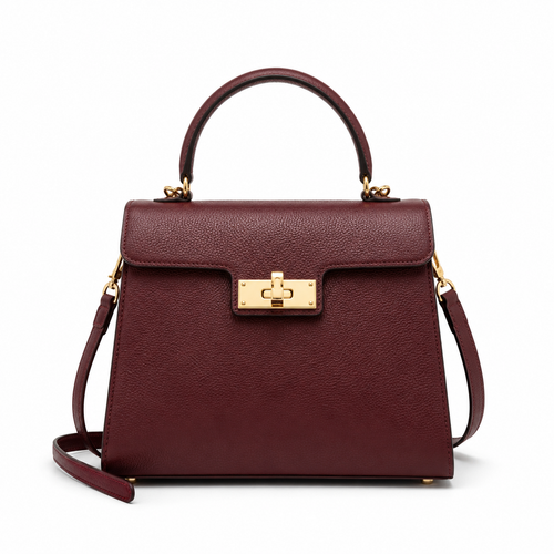 Front view of burgundy leather handbag with gold hardware.