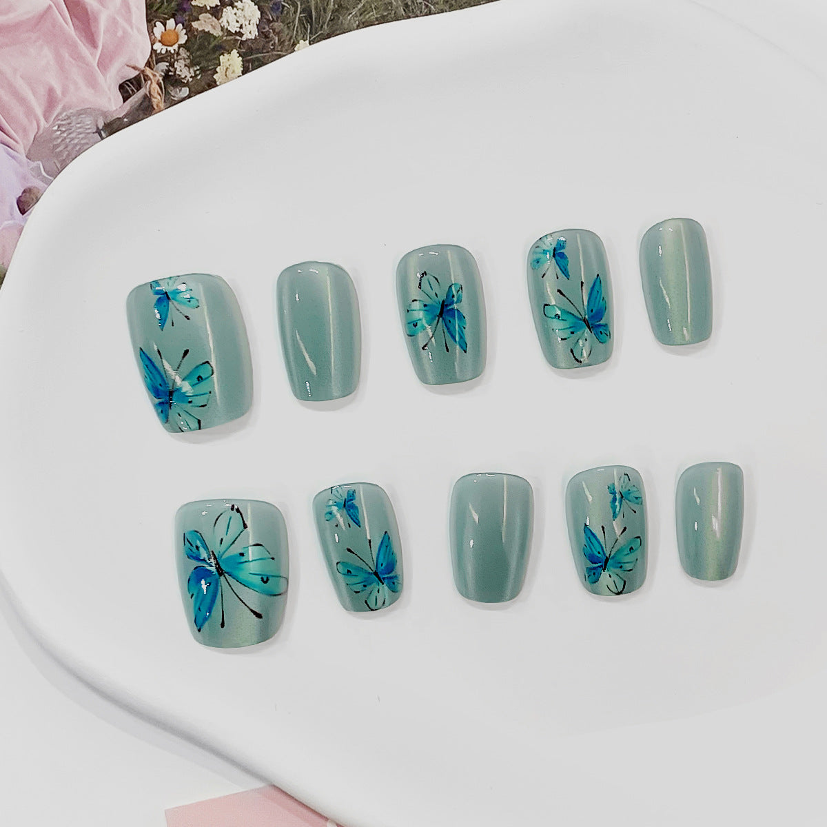 Artistic Acrylic Nails with Butterfly Motif