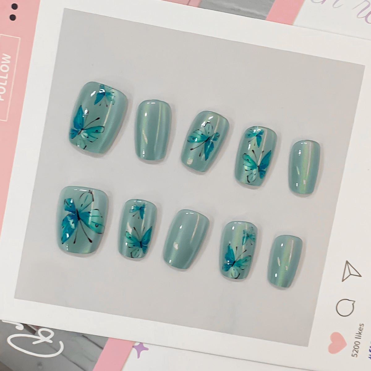 Artistic Acrylic Nails with Butterfly Motif