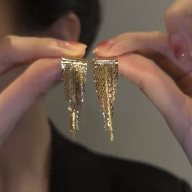 Golden shining city tassel earrings