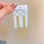 Golden shining city tassel earrings