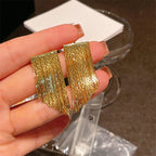 Golden shining city tassel earrings