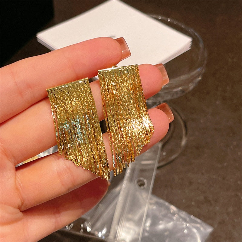 Golden shining city tassel earrings