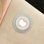 Heart-Shaped Coaster with Playful Design