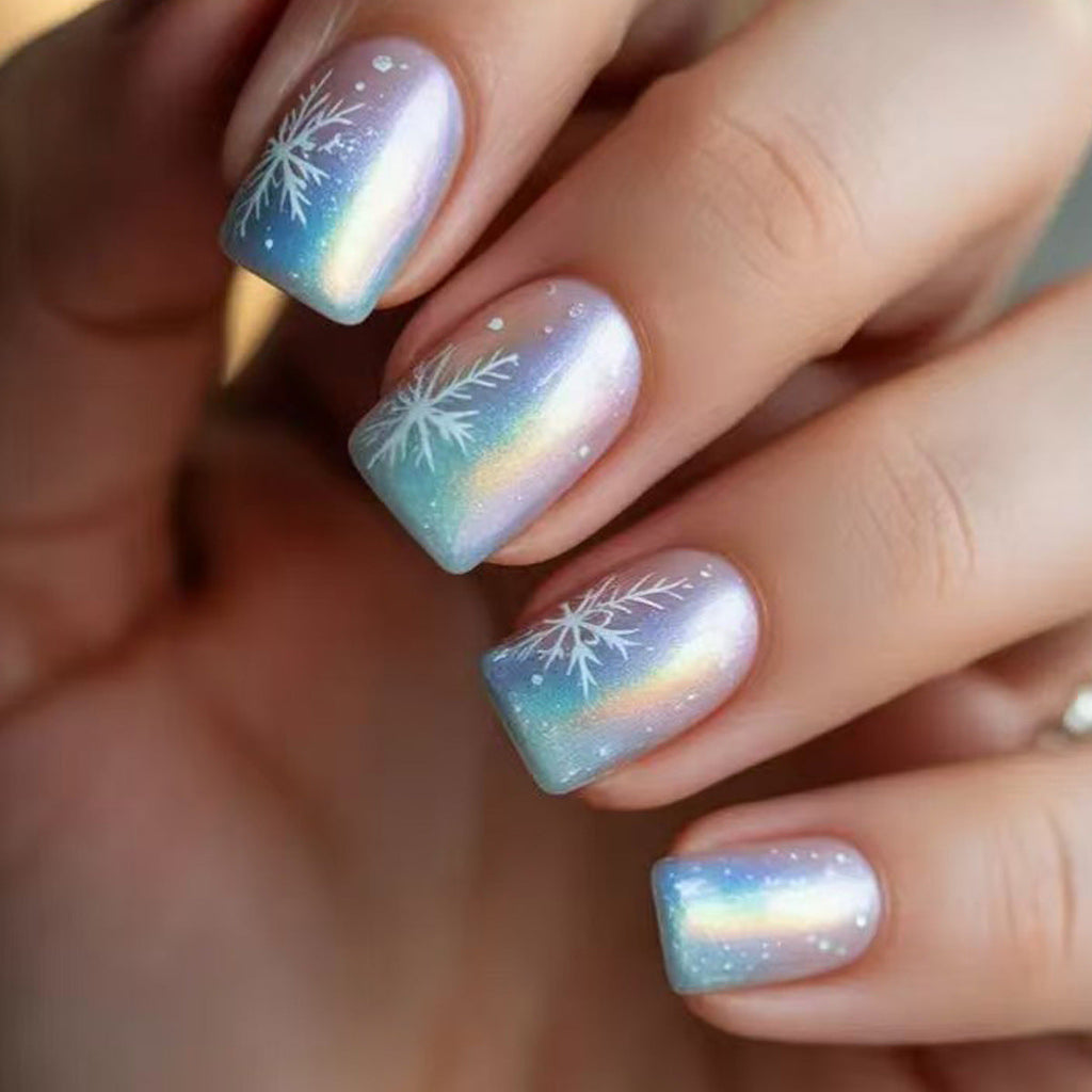 Wintry Artistic Nails with Shimmering Snowflake Design