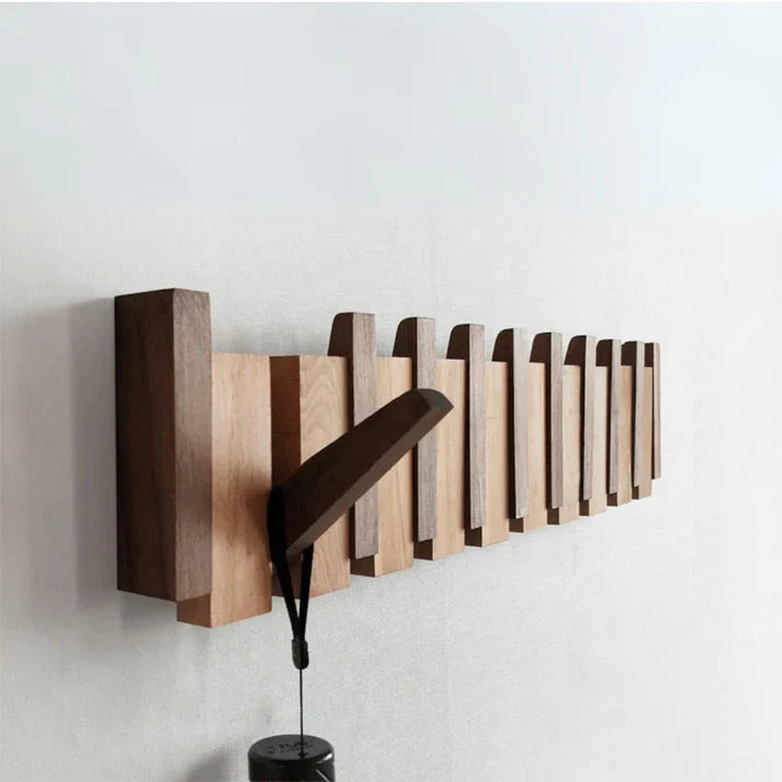 Wooden wall-mounted coat rack with piano key design, elegant and durable