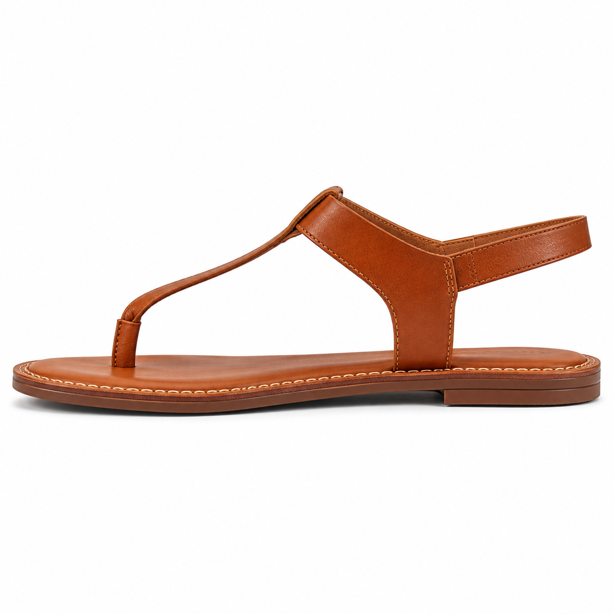 Women's T-strap vegan leather sandal in cognac with antique brass ankle buckle and stitched leather welt, three-quarter view
