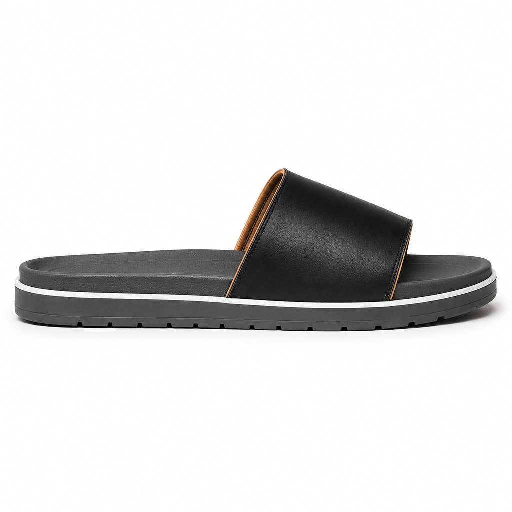 Front view of men's black single-band vegan leather slide sandal showing the dark grey contoured footbed and warm tan piping