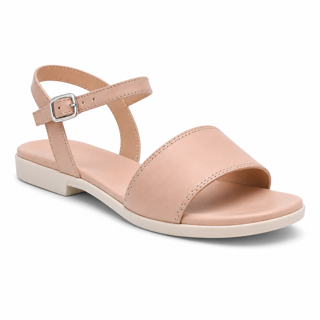 Inner side view of women's nude blush single-buckle vegan leather sandal showing clean leather profile and slim cream sole