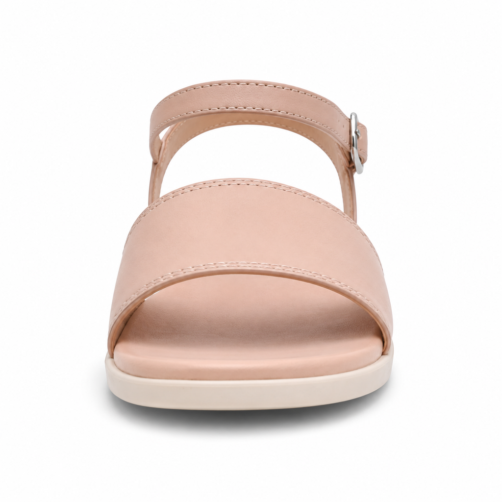 Side profile of women's nude blush single-buckle vegan leather sandal showing the brushed silver ankle buckle