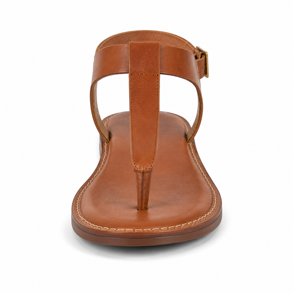 Inner side view of women's cognac T-strap vegan leather sandal showing the T-bar silhouette and stitched leather welt