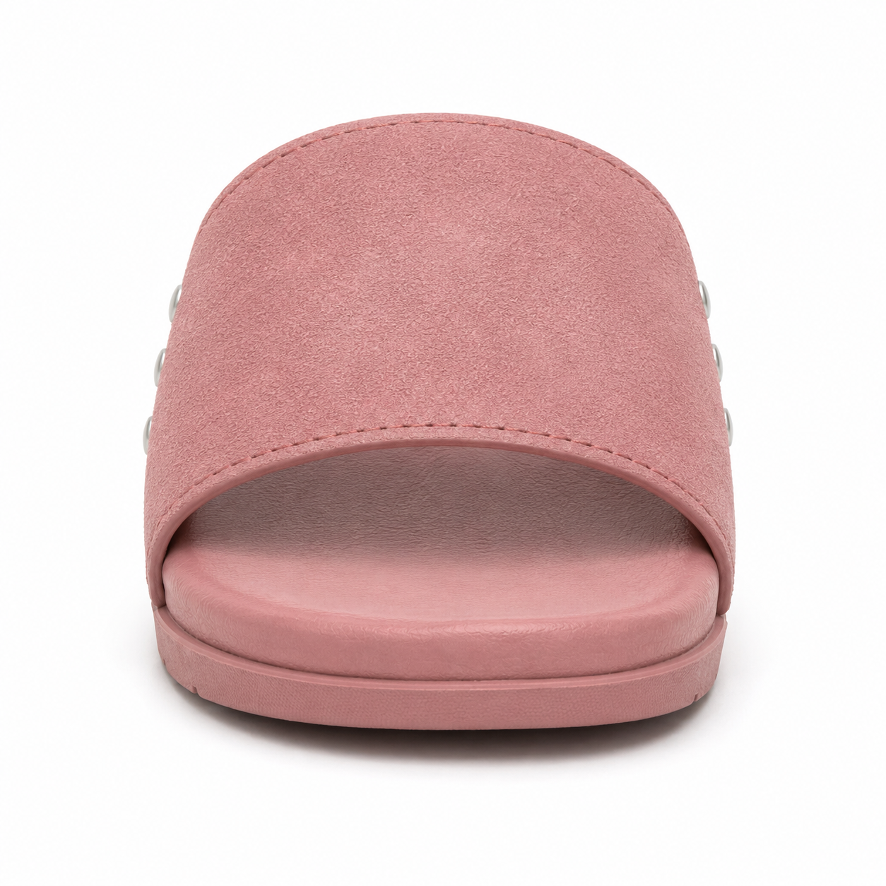Side profile of women's dusty rose vegan suede slide sandal showing brushed silver rivets and tonal dusty rose rubber outsole
