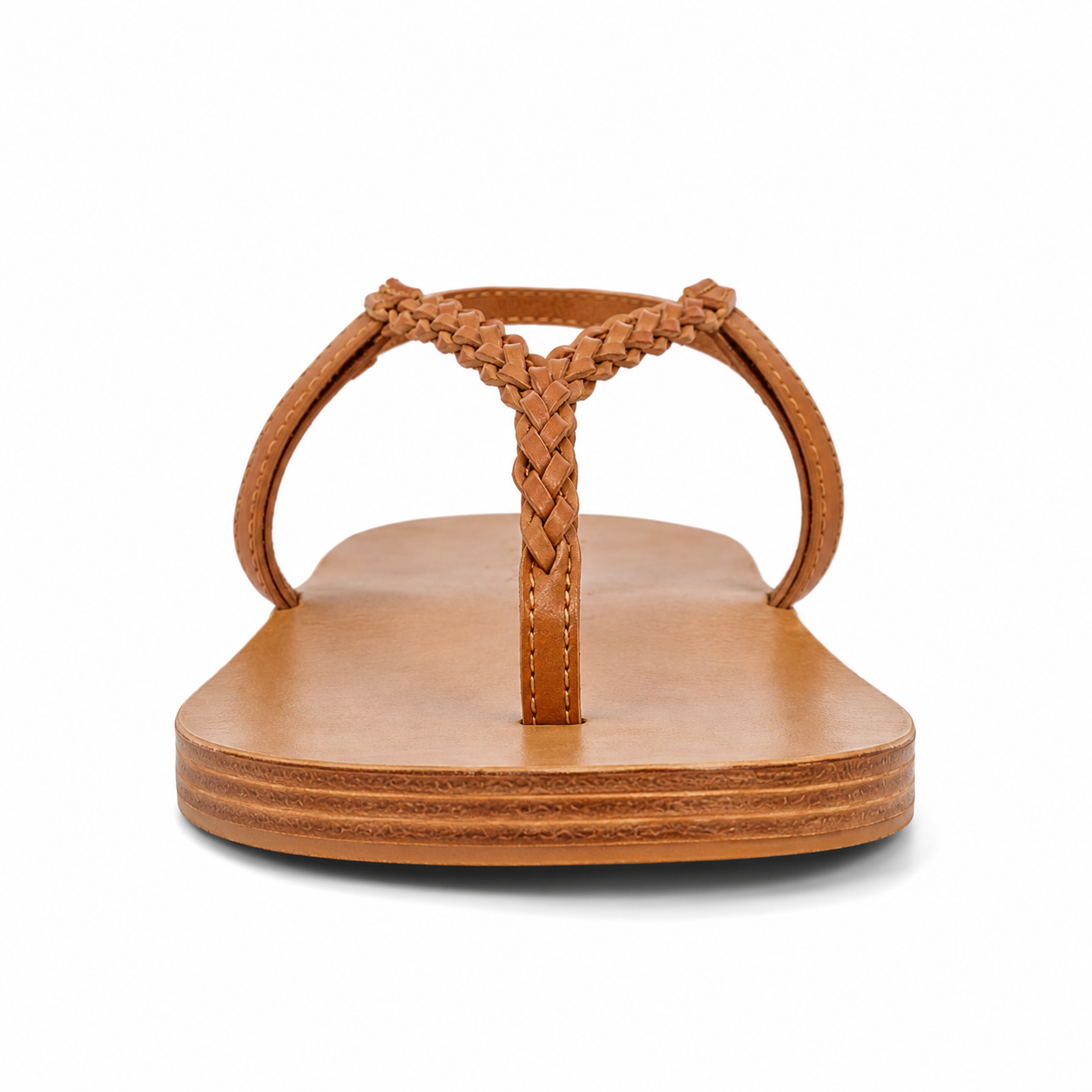Side profile of women's tan slingback thong vegan leather sandal showing braided Y-strap and slingback strap