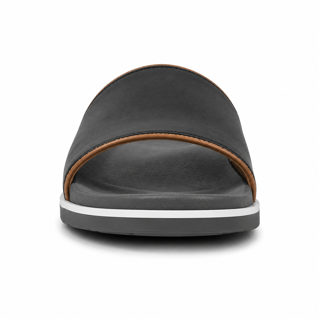 Side profile of women's matte black single-band vegan leather slide sandal showing the grey rubber outsole with white midsole stripe