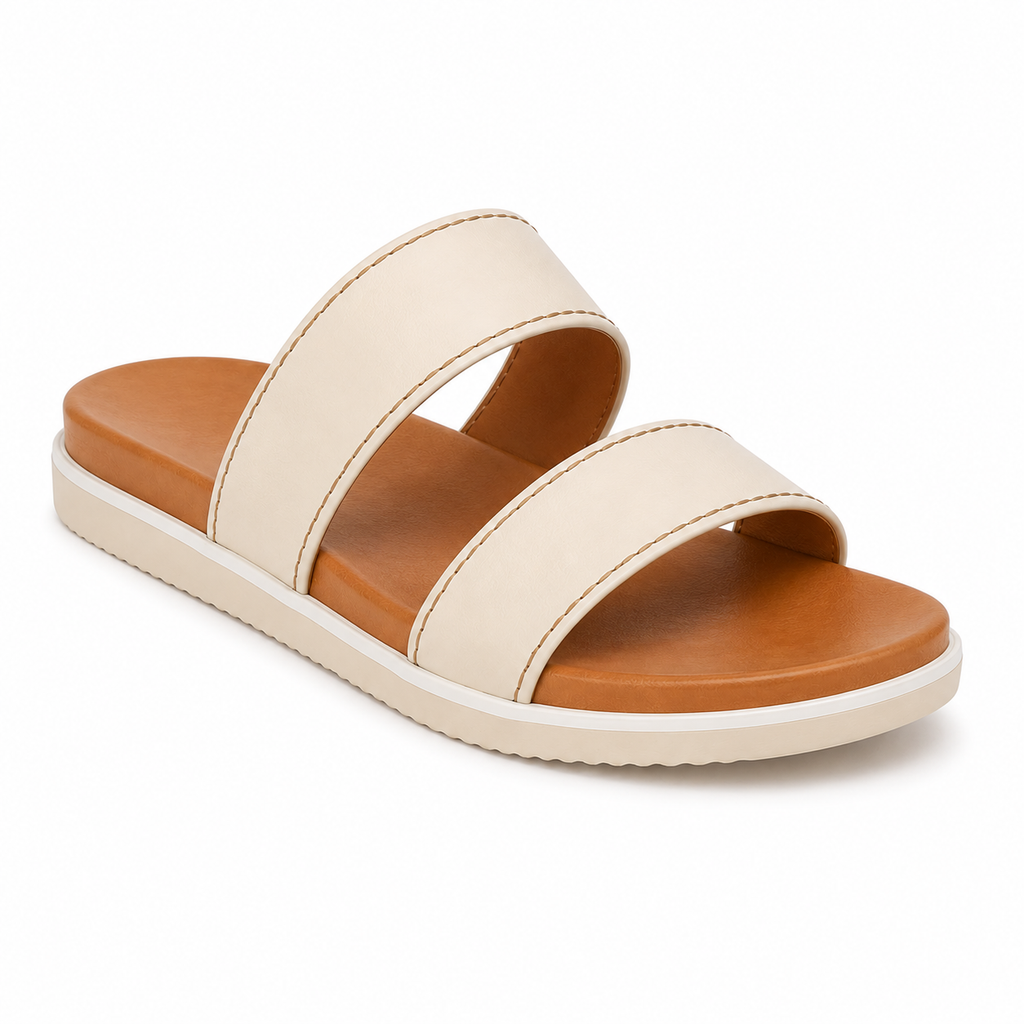 Side profile of women's cream and tan two-tone vegan leather slide sandal showing the white midsole stripe and cream rubber outsole