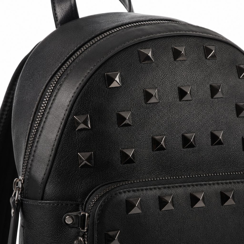 Zipper closure detail on black leather backpack