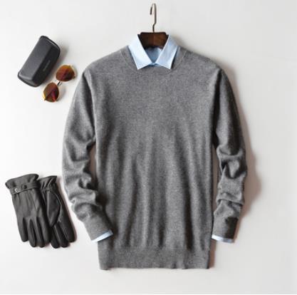 Men's cashmere jumper layered over shirt for smart-casual look