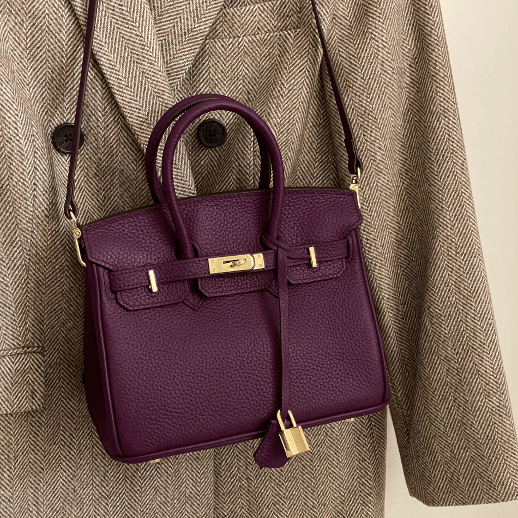 Detail shot highlighting quality craftsmanship and leather texture of handbag
