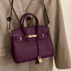 Detail shot highlighting quality craftsmanship and leather texture of handbag