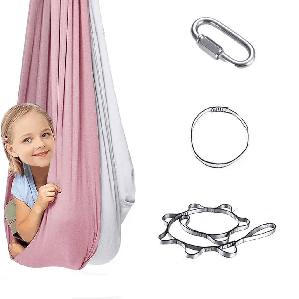 Child swinging gently in pink sensory hammock, developing balance and body awareness.