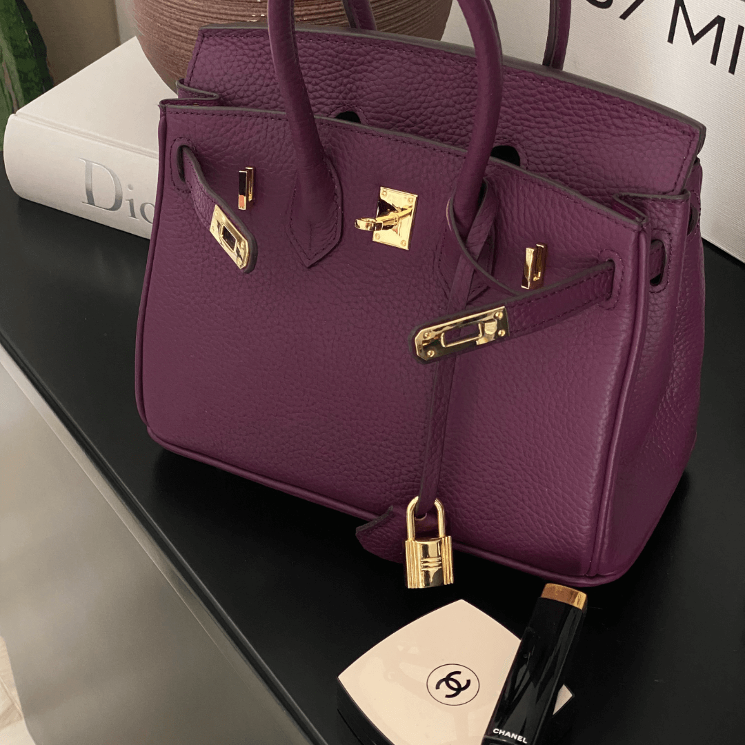 Luxury leather handbag worn in lifestyle setting showing elegant design