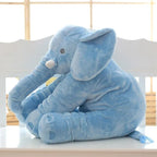 Elephant plush pillow being used by baby for nap and rest time