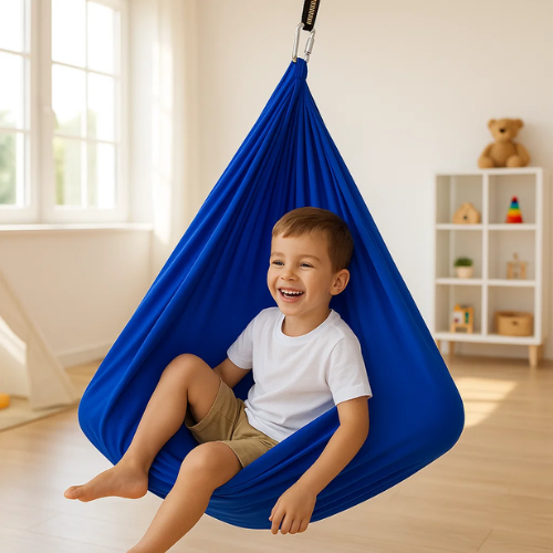 Close-up of child feeling safe and calm inside grey sensory cocoon swing.