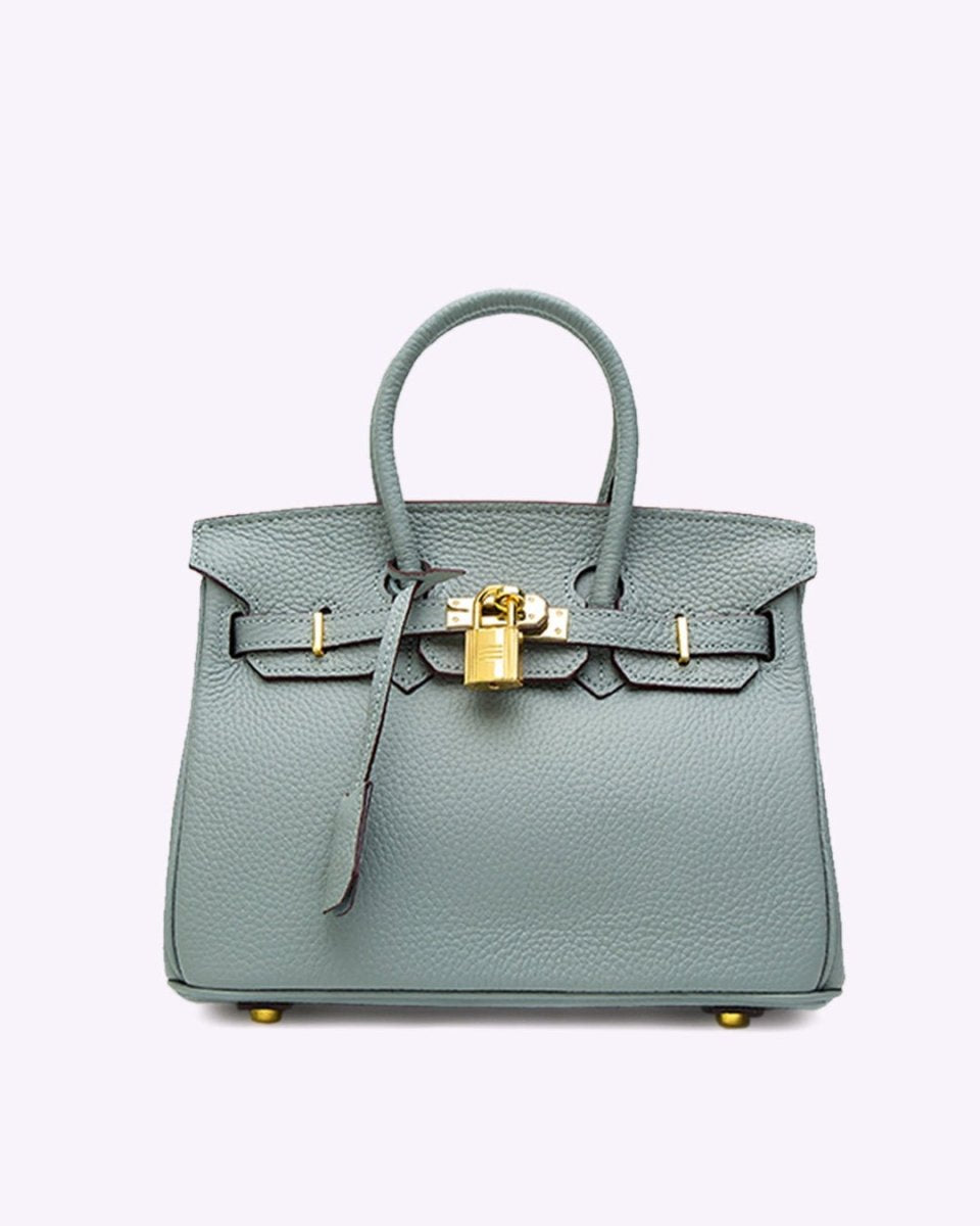 Luxury leather handbag in use demonstrating practical everyday functionality