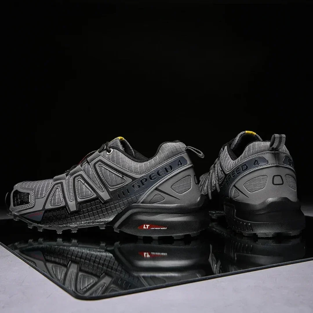 SpeedCross IV trainers on muddy trail terrain demonstrating exceptional grip performance.