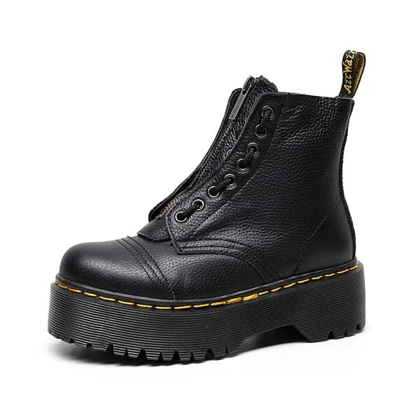 Women's black leather boots with chunky sole, side view showing sleek silhouette and modern design.
