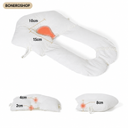 Ergonomic Baby Sleep Cushion by BONEROSHOP in soft pastel colour, showing the womb-like curved design.