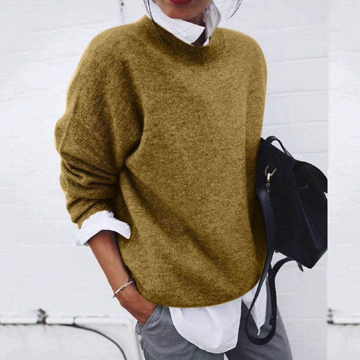 Stylish cashmere jumper displayed in elegant colour, showcasing luxurious texture and modern design.