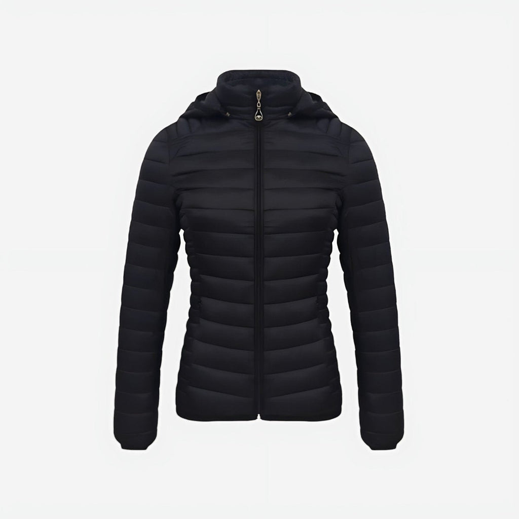 Woman wearing lightweight puffer jacket in natural outdoor setting