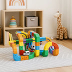 3D train track circuit educational toy with colourful cubes and marble run assembled on white surface