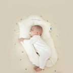 Baby sleeping peacefully in the BONEROSHOP Ergonomic Sleep Cushion, demonstrating proper head and neck support.