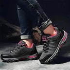 Women's all-terrain hiking shoes featuring GORE-TEX waterproof membrane for all-weather protection