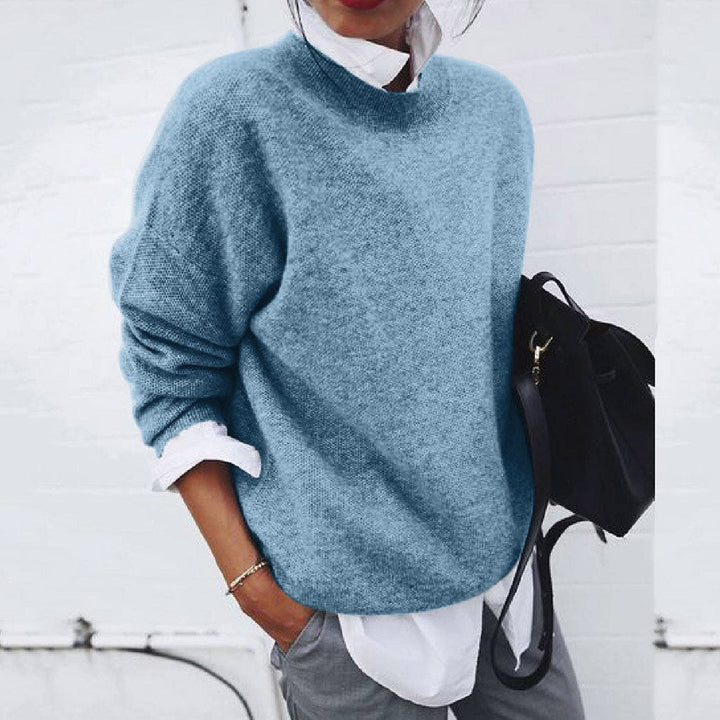 Close-up view of the cashmere jumper highlighting the soft, premium fabric and refined craftsmanship.