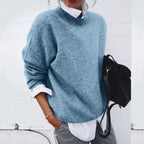 Close-up view of the cashmere jumper highlighting the soft, premium fabric and refined craftsmanship.