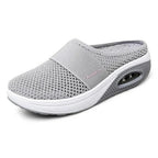 Side profile of OrthoAir shoes showing open practical design and sleek minimalist styling