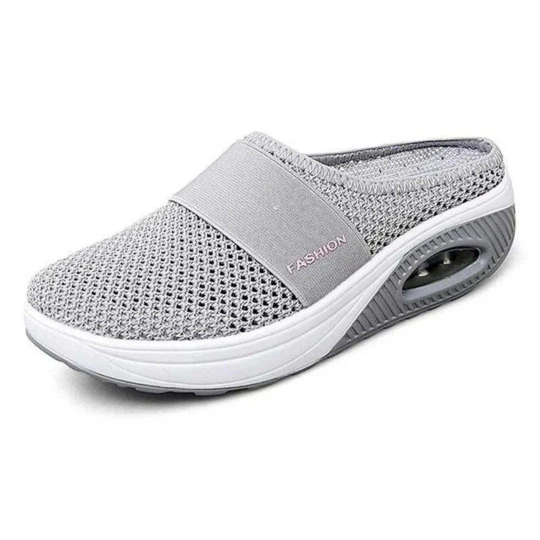Side profile of OrthoAir shoes showing open practical design and sleek minimalist styling