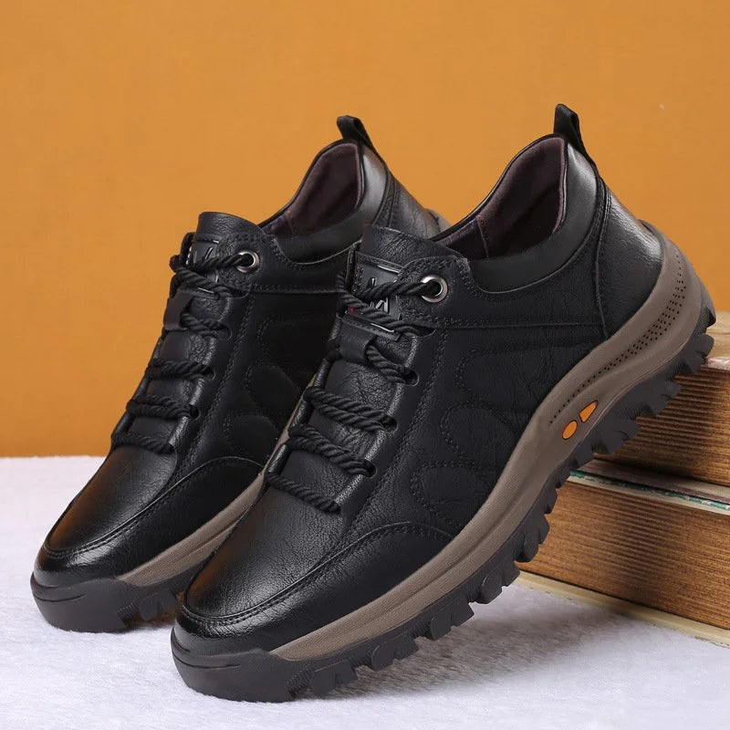 Side profile of men's orthopaedic leather boots illustrating ergonomic insole and arch support technology.